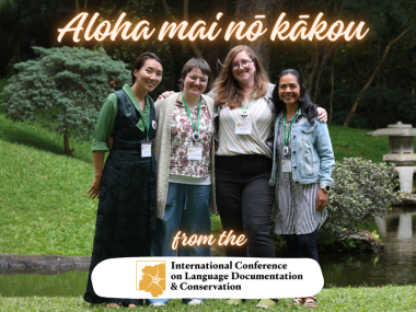 Four women standing in a garden, with text "Aloha mai nō kākou from the International Conference on Language Documentation & Conservation"